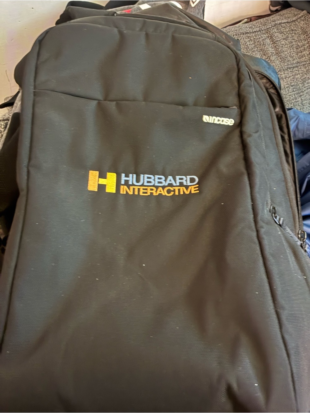 Incase Black Backpack with Yellow and Blue Hubbard Interactive Logo